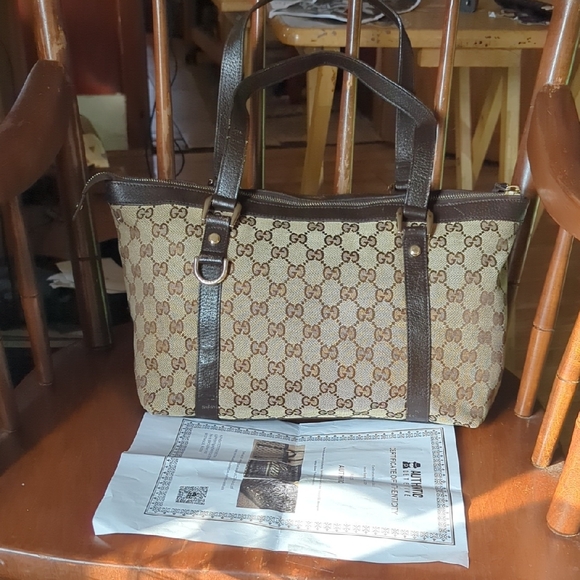 Gucci Handbags - Gucci Beige and Brown Monogram Briefcase..with a COA. Very little flaws.